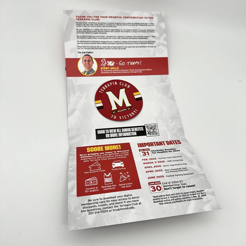 University of Maryland Membership self mailer unfolds to reveal branded sticker inside by Strategic Factory.