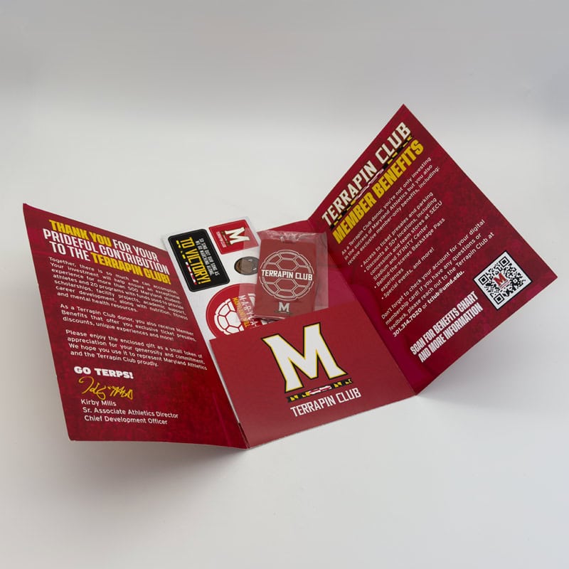 University of Maryland Membership self mailer unfolds to reveal QR code and branded swag inside by Strategic Factory.