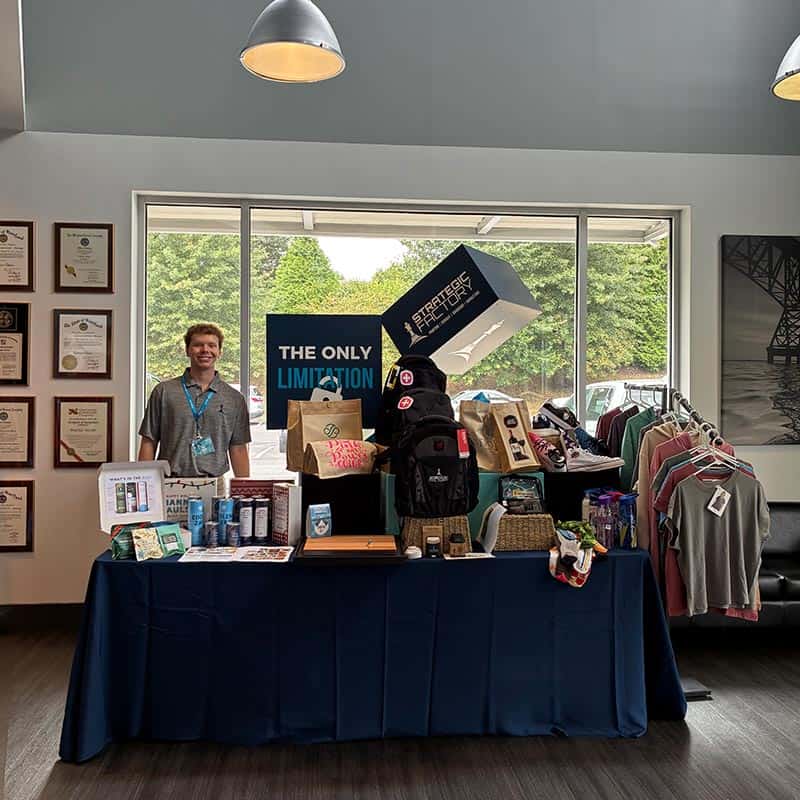 corporate gifting event booth displaying promotional products and branded apparel