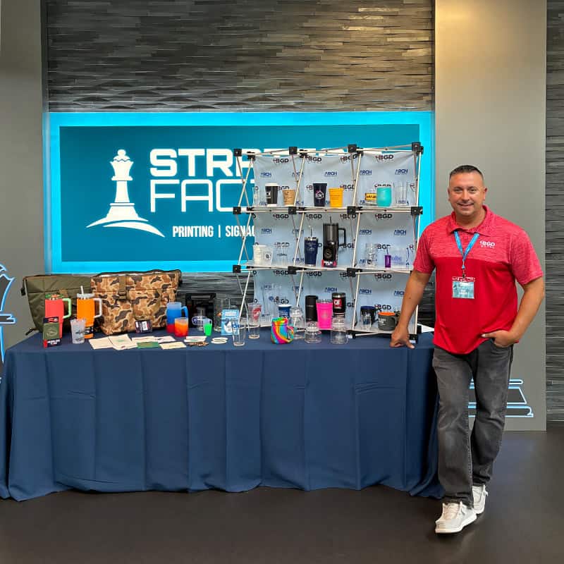 branded gifts displayed on event booth table