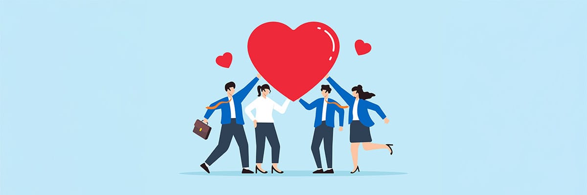illustration of four business professionals holding up a large heart for Giving Tuesday