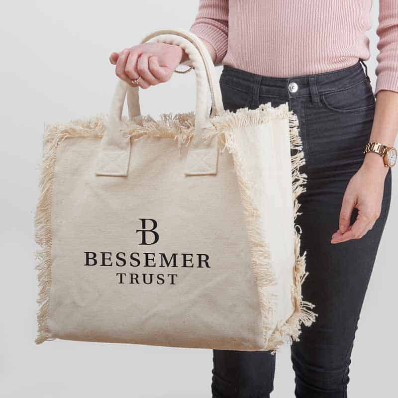 Custom branded resort bags that reads Bessemer Trust, by Strategic Factory.