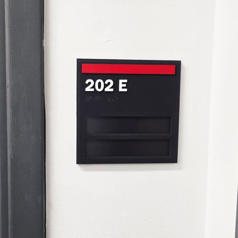 Custom braille signage fabricated and installed by Strategic Factory
