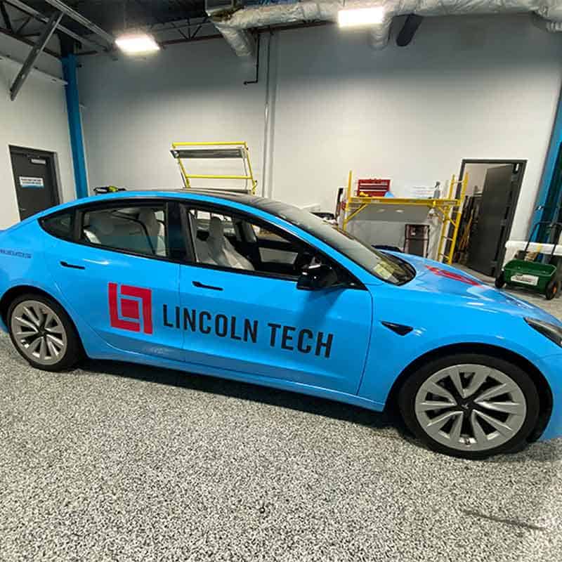 Vinyl car graphics for Lincoln Tech made by Strategic Factory.
