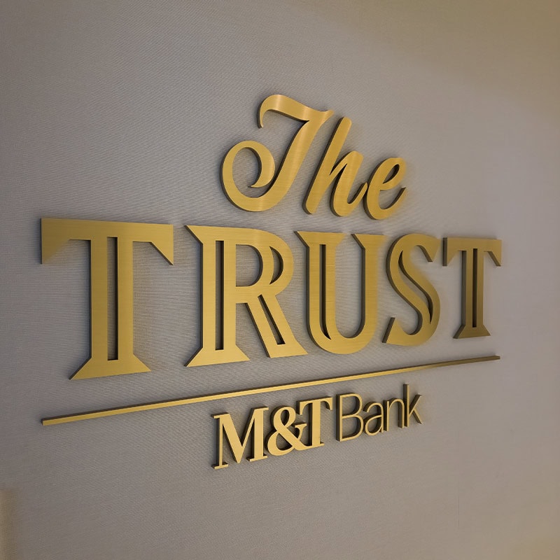 brushed gold metal dimensional letters of 'The Trust' suite entrance at the M&T Bank Stadium