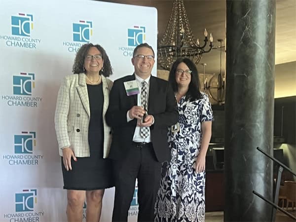 Robert Cardoni poses with Howard County Chamber of Commerce leaders as he accepts his Ambassador of the Year Award.