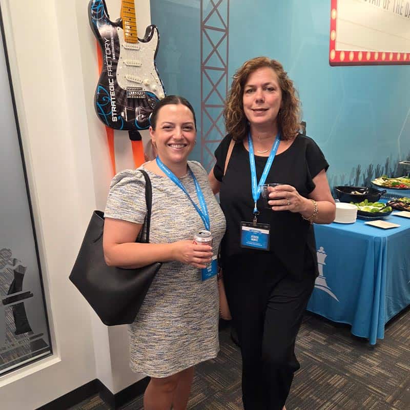 Professionals at networking happy hour at Strategic Factory.