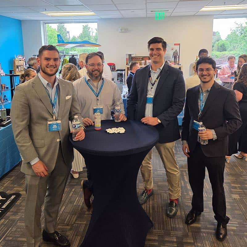 Networking businessmen at Strategic Factory's Sip and Connect.