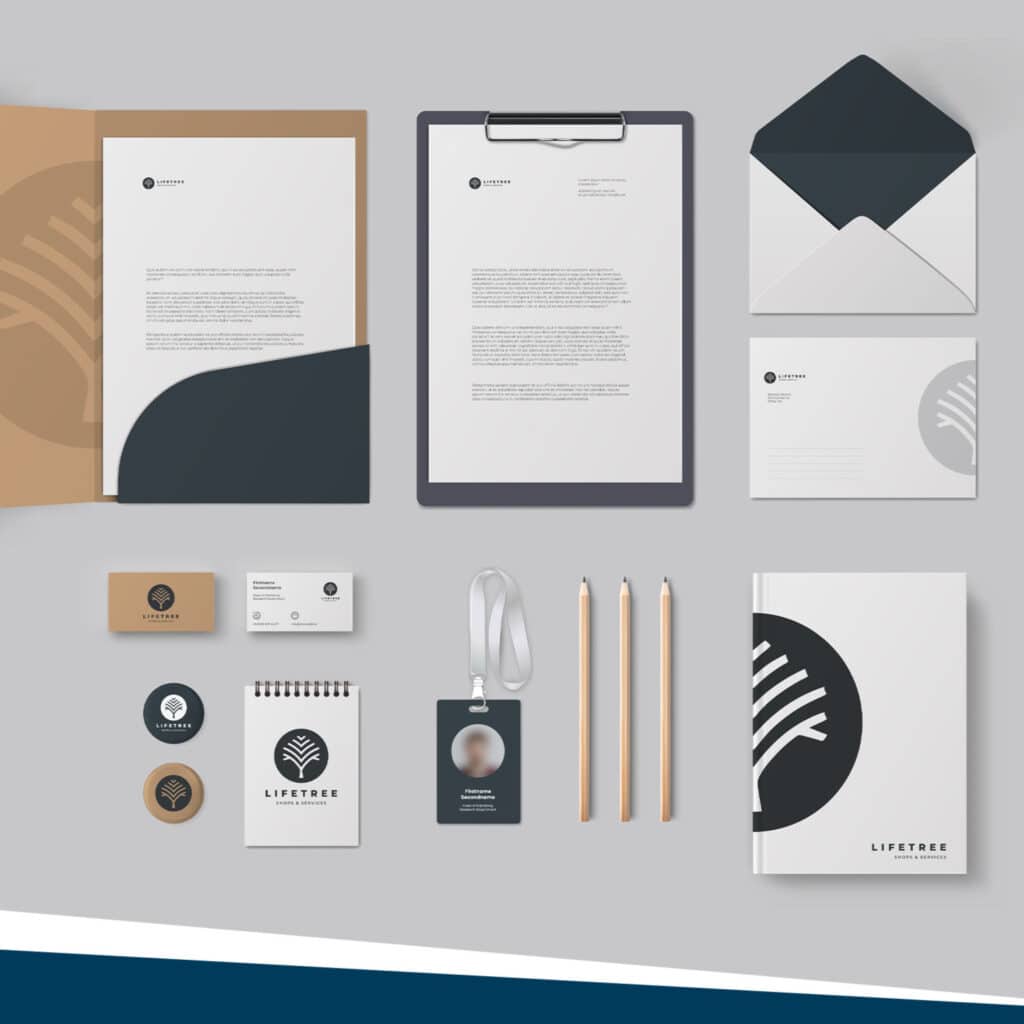 Stationery design of promo items with a black and white logo by Strategic Factory.