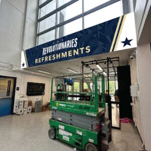 GW Revolutionaries athletics concessions stand signage