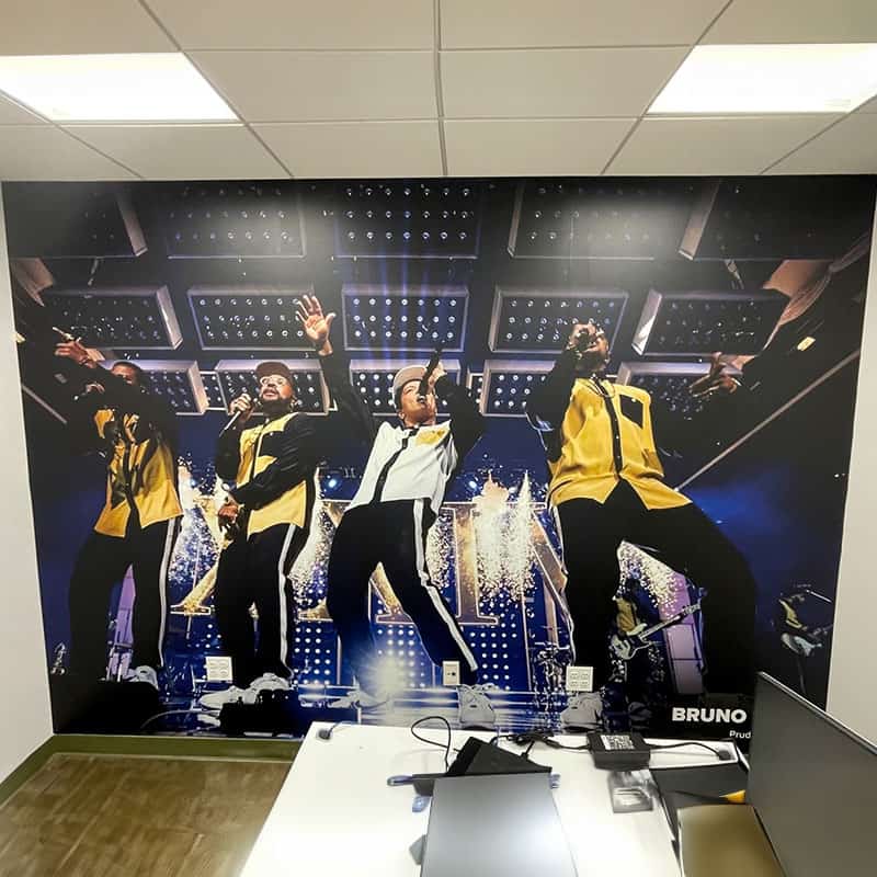 Floor to ceiling wall graphic of Bruno Mars installed at the CFG Bank Arena