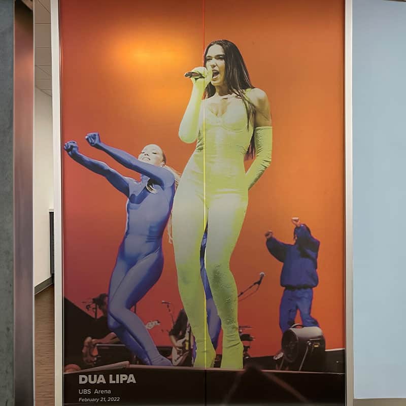 Floor to ceiling wall graphic of Dua Lipa installed at the CFG Bank Arena