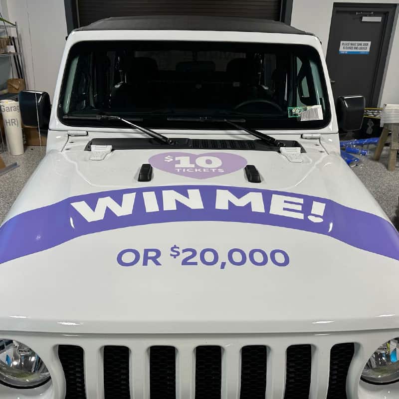 Mile One Autogroup branded vehicle wrap for a jeep giveaway