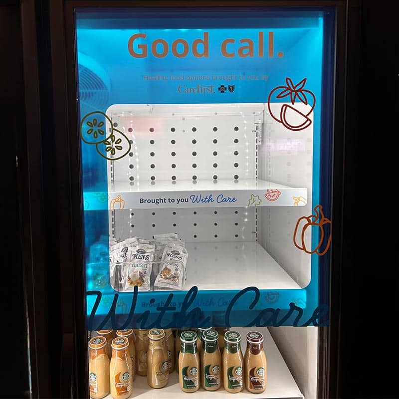 Carefirst vinyl fridge graphics that promote healthy eating and brand's tagline 'with care'