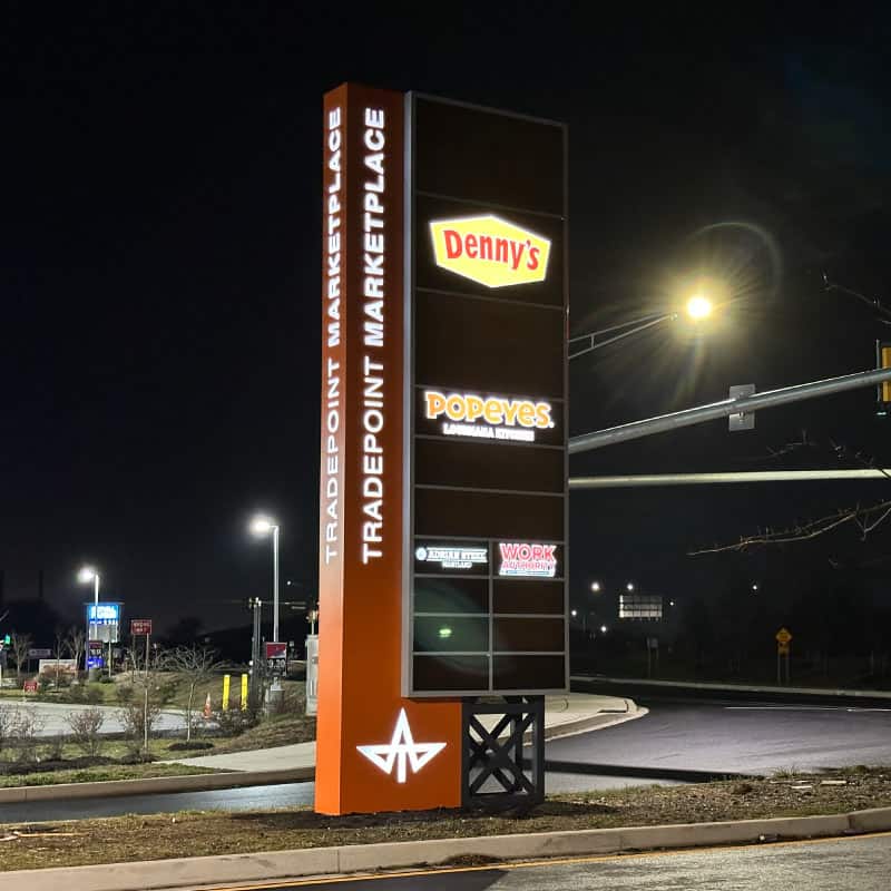 Tradepoint Atlantic illuminated pylon sign at night
