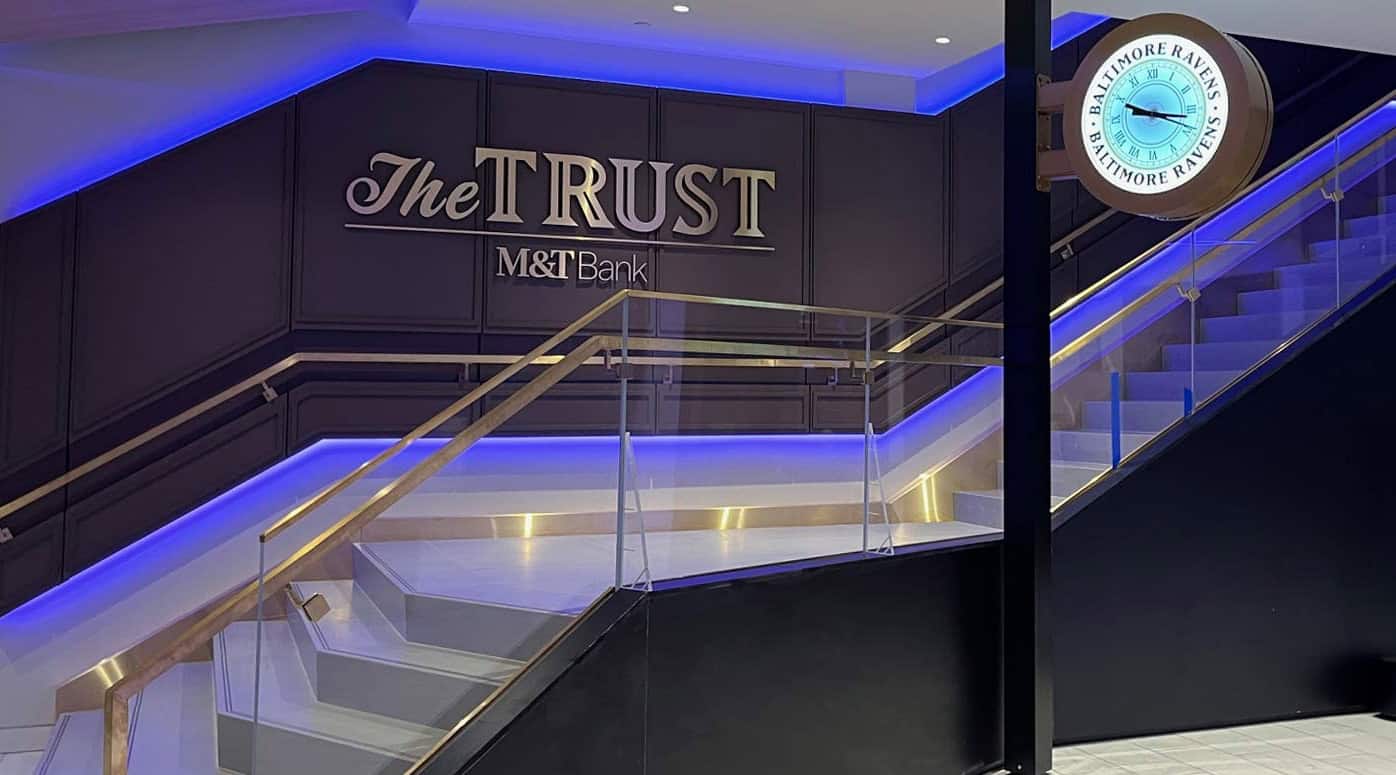 Interior view of The Trust, M&T Bank club area at M&T Bank Stadium with illuminated Baltimore Ravens clock.